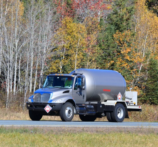 A semi truck carrying flammable materials in a tank.