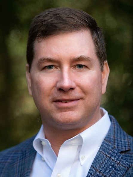 Jeff Simpson looks into the camera with a slight smile on his face.